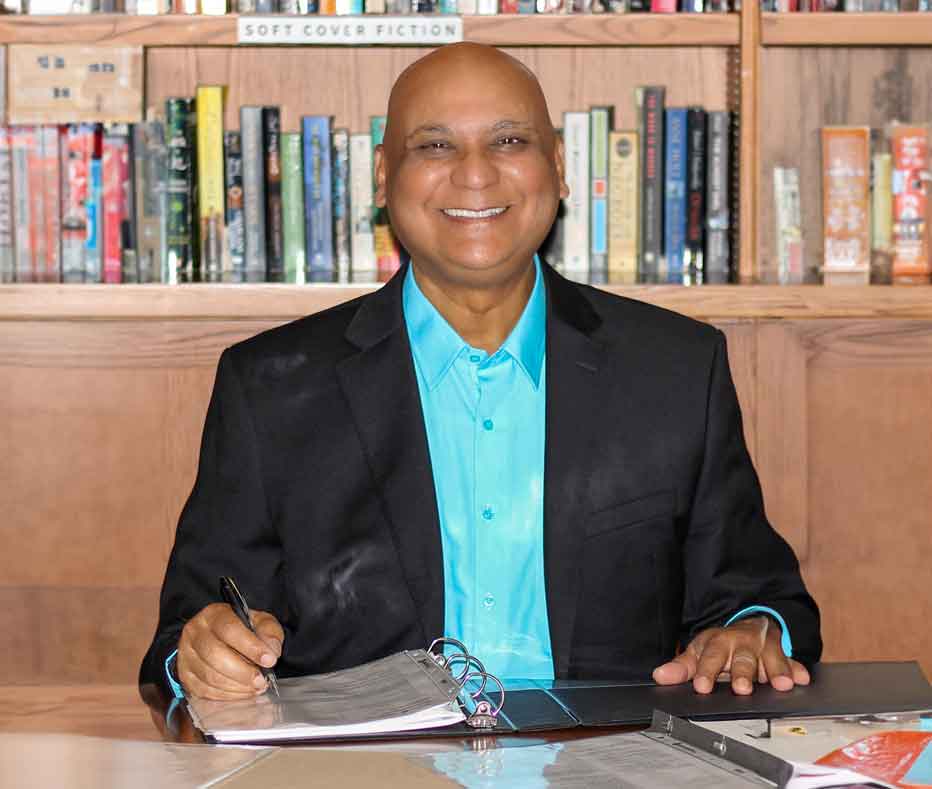 Augustin James signing documents