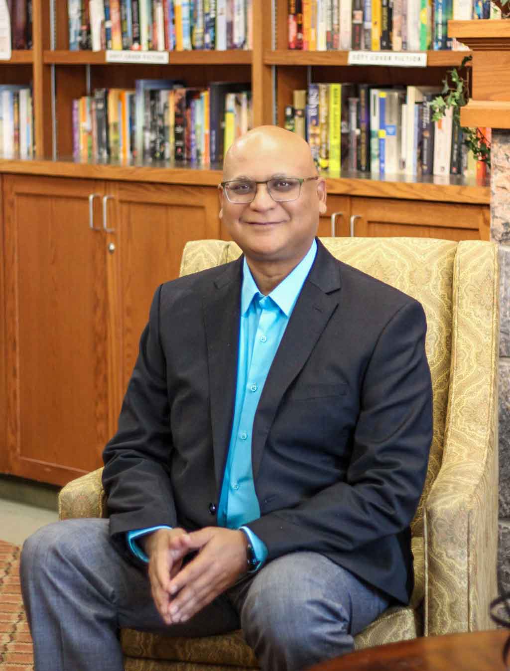 Augustin James sitting on coach